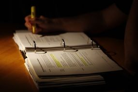 Child is writing in the notebook