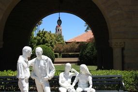 four white statues near stanford university