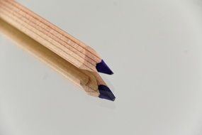 pencil sharpened edge with blue core and its reflection