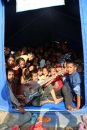 kids in a tent playing guitar