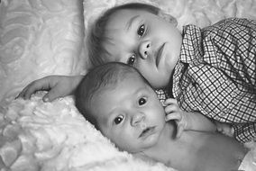 black and white photo of two little brothers