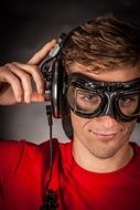 music lover with headphones and mask