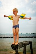 little boy ready to jump in water