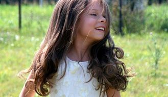 girl with long hair smiling