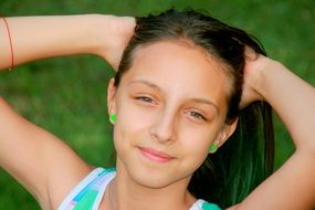 portrait of a girl with a smile and with collected hair