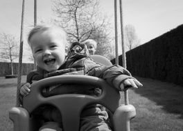 happy boy on a swing