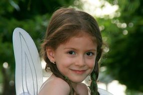 portrait of a little girl with wings