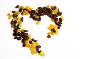 Black and yellow raisins in the form of a heart