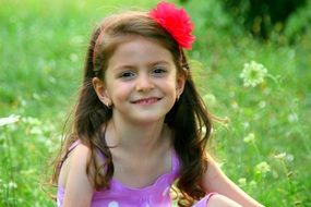 cute girl with red bow portrait