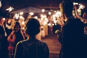 people at a wedding at night