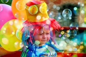 happy baby in soap bubbles