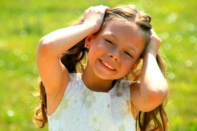 smiling girl with long hair at background summer nature