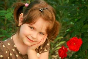 portrait of a smiling girl on a background of flowers