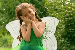 child in a suit with wings