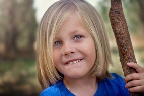 happy little girl with blond hair