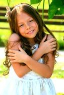 Smiling girl with the long hair in summer