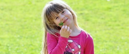 smiling girl in pink t-shirt