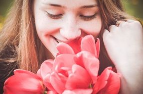 girl enjoys flowers