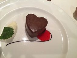 chocolate heart on a white plate as a gift