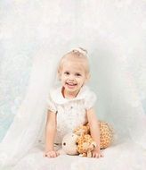 little girl in white at a photo shoot