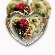 heart form glass decoration with floral arrangement