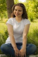 photo portrait of a smiling girl in a white t-shirt