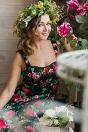 beautiful woman with wreath in floral dress