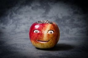 apple with eyes carved and mouth