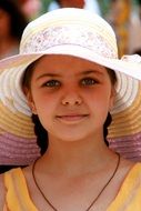 Smiling girl wearing white hat