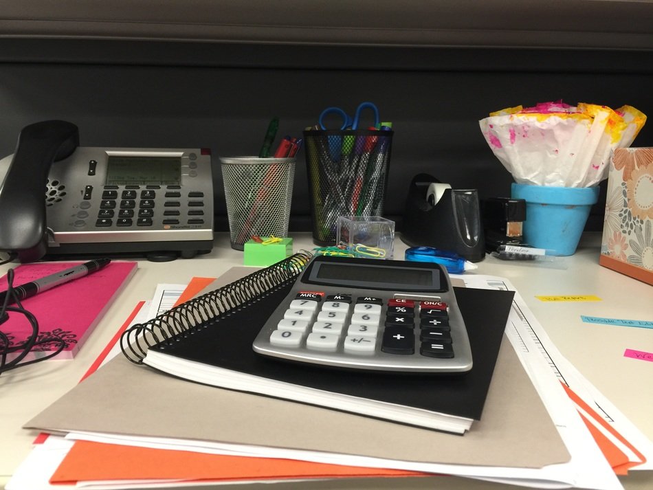desk with notebooks in office space