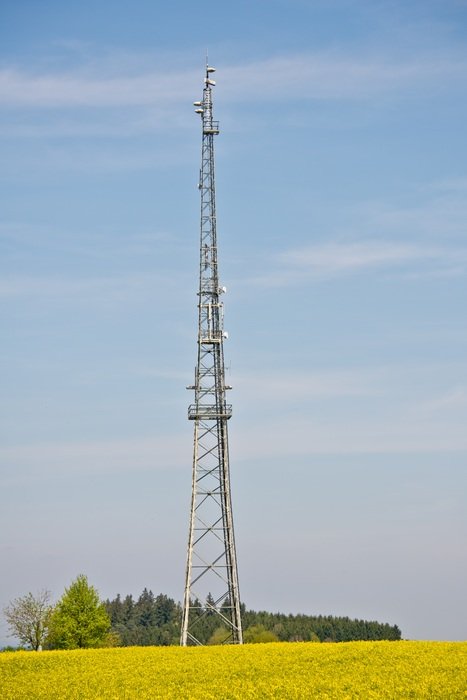 radio tower on a yellow field