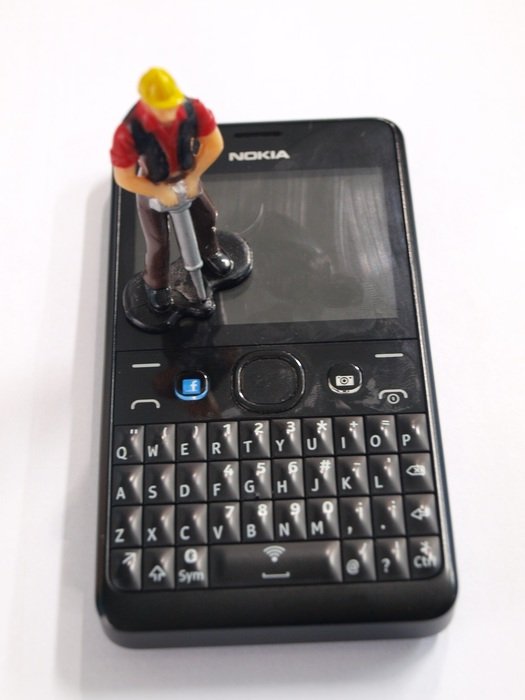 Toy man on the black phone