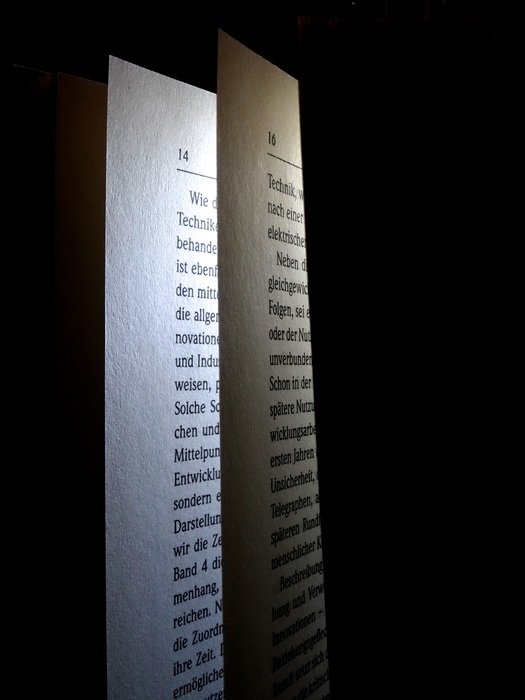 light from the book at dark background