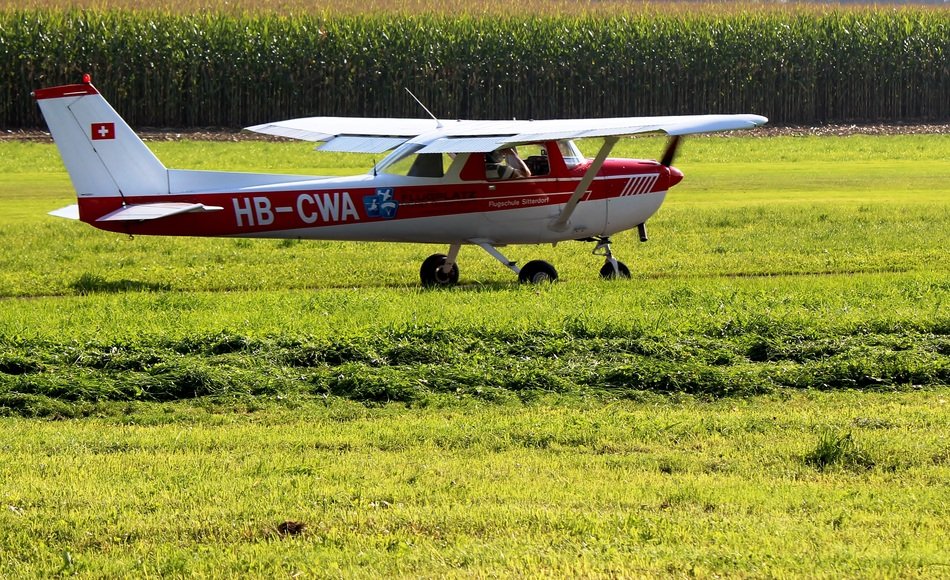 light aircraft on a green field