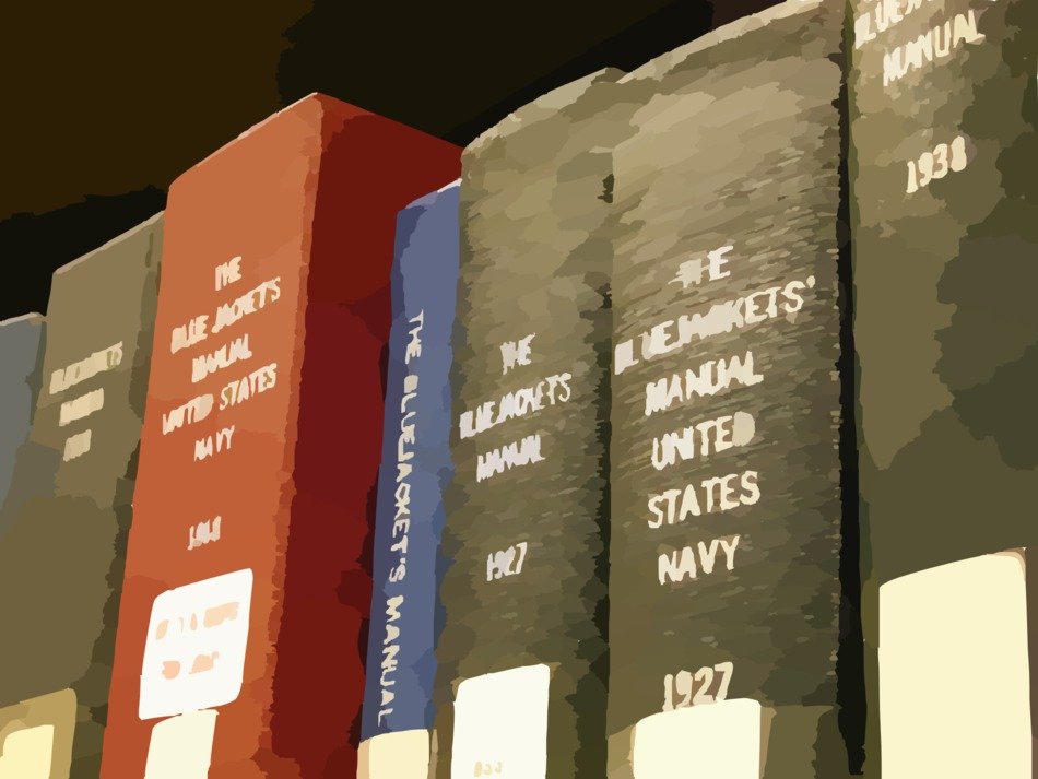 thick multicolored books on the shelf