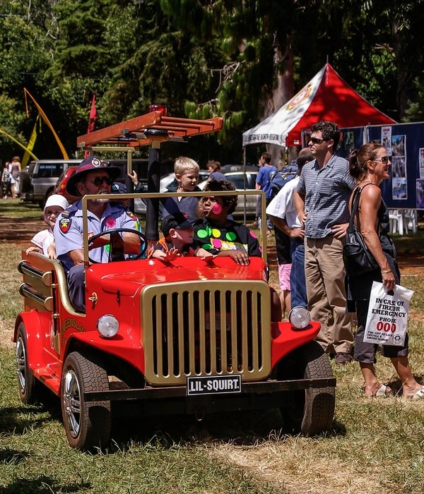 children in a mini fire truck