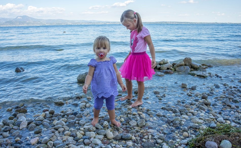 children girls on the see shore