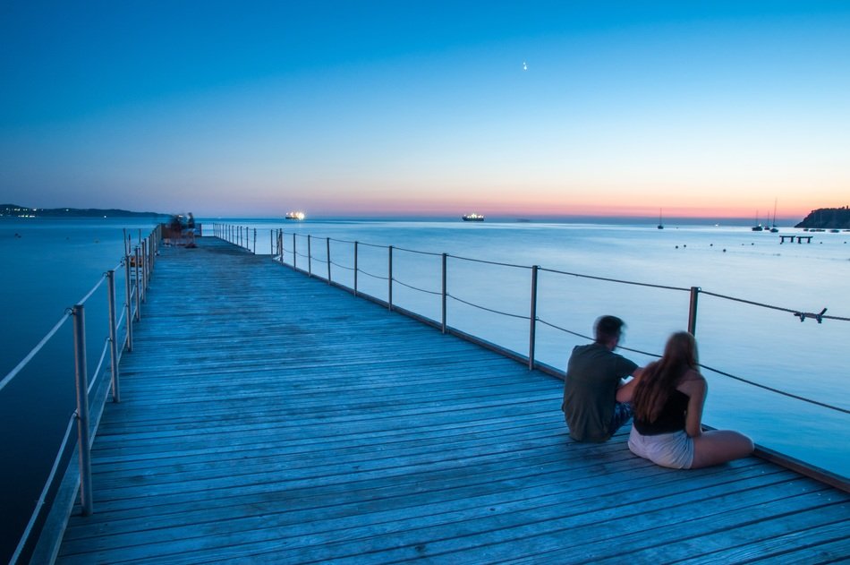 couple in love on the dock at dusk