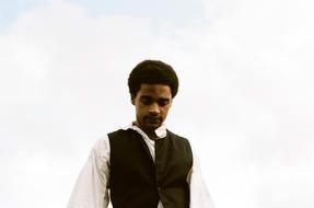 black man in a black vest