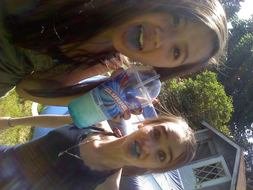 photo of girls with blue tongues