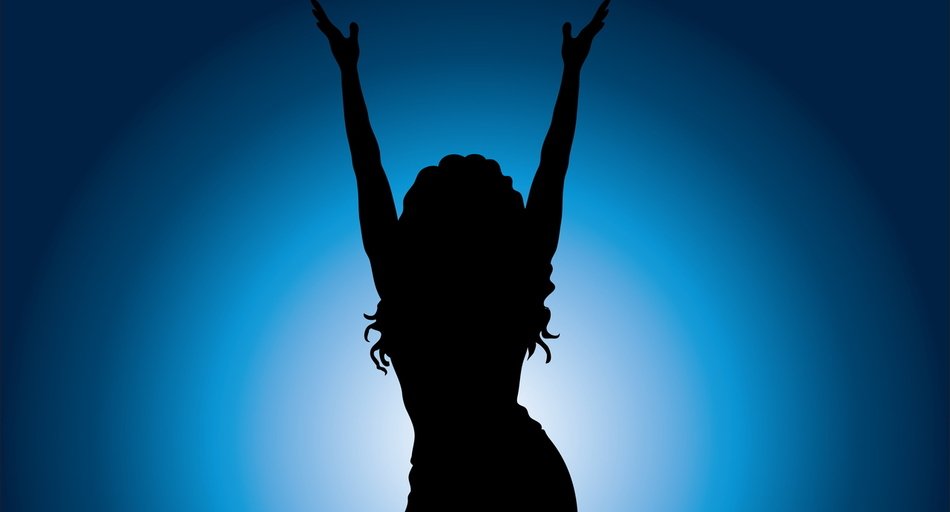 silhouette of long haired woman holding hands up at blue background