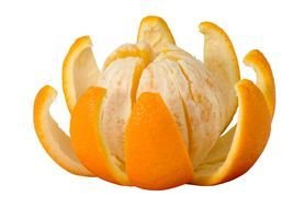 orange fruit on peel in shape of flower