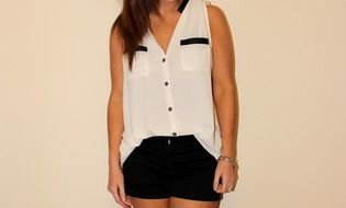 photo of a girl in a white blouse and black shorts