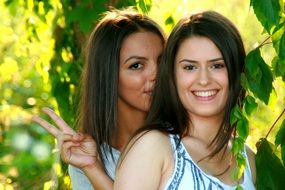 two girlfriends smiling