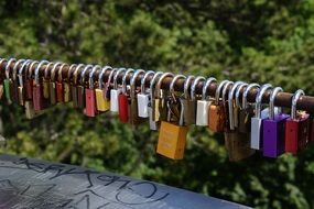 handrail covered by locks of lovers