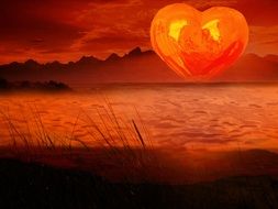 orange heart form sun at water, romantic sunset