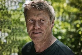 portrait of a smiling man in nature