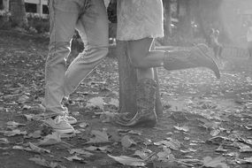 black and white photo of a couple in love on the street