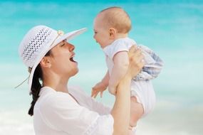 Happy mother and child on a blue background