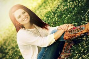 girl smiling and posing sitting